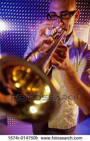 Young man playing the trumpet View Large Photo Image Stock Image - Young man playing the trumpet. Fotosearch