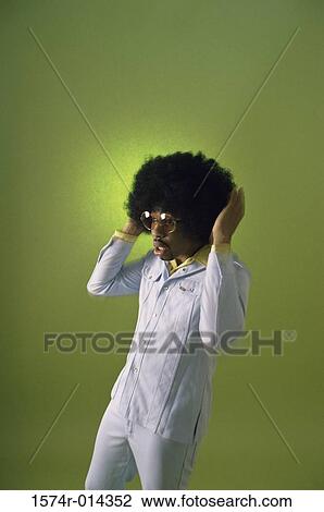 Young man with his hand in his hair View Large Photo Image Stock Image - Young man with his hand in his hair. Fotosearch