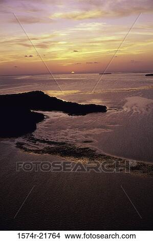 Aerial view of a beach at sunset View Large Photo Image Picture - Aerial view of a beach at sunset. Fotosearch