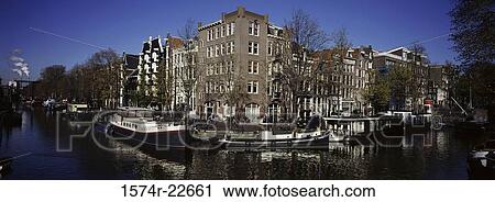 Boats on a canal, Amsterdam, Netherlands View Large Photo Image Stock Image - Boats on a canal, Amsterdam, Netherlands. Fotosearch