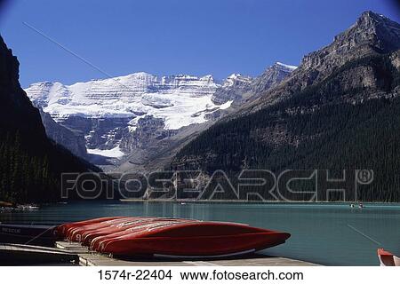 Canoes in a row on a dock, Lake Louise, Banff National Park, Alberta, Canada View Large Photo Image Picture - Canoes in a row on a dock, Lake Louise, Banff National Park, Alberta, Canada. Fotosearch