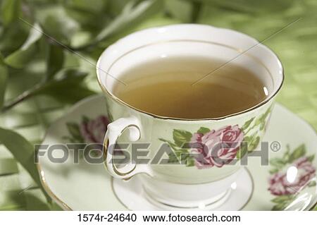 Close-up of a cup of green tea on a saucer View Large Photo Image Stock Image - Close-up of a cup of green tea on a saucer. Fotosearch