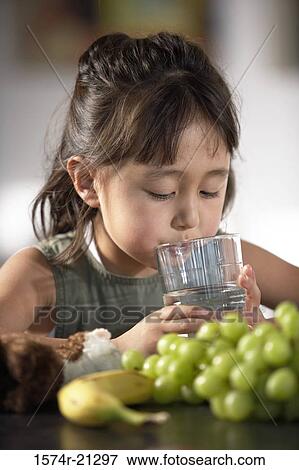 Stock Photo - Close-up of a girl drinking water. Fotosearch