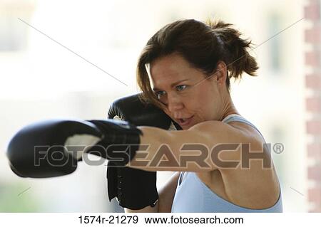 Close-up of a mature woman practicing boxing View Large Photo Image Stock Photo - Close-up of a mature woman practicing boxing. Fotosearch