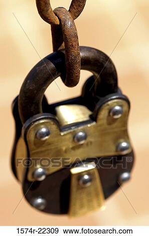 Close-up of a padlock on a chain View Large Photo Image Stock Photo - Close-up of a padlock on a chain. Fotosearch