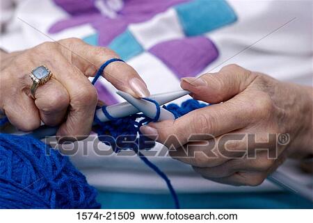 Close-up of a person knitting View Large Photo Image Stock Photo - Close-up of a person knitting. Fotosearch