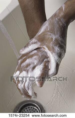 Close-up of a person washing hands with soap View Large Photo Image Picture - Close-up of a person washing hands with soap. Fotosearch