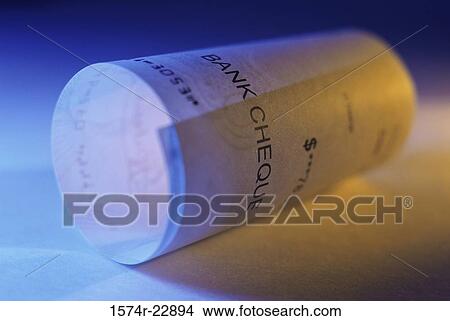 Close-up of a rolled check View Large Photo Image Picture - Close-up of a rolled check. Fotosearch