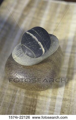 Close-up of a stack of pebbles View Large Photo Image Stock Photograph - Close-up of a stack of pebbles. Fotosearch