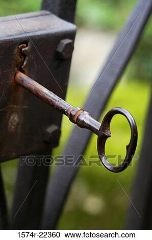 Close-up of an antique key in a lock View Large Photo Image Stock Image - Close-up of an antique key in a lock. Fotosearch