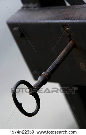 Close-up of an antique key in a lock View Large Photo Image Stock Photo - Close-up of an antique key in a lock. Fotosearch