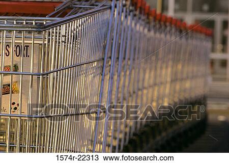 Close-up of empty shopping carts in a row View Large Photo Image Stock Image - Close-up of empty shopping carts in a row. Fotosearch