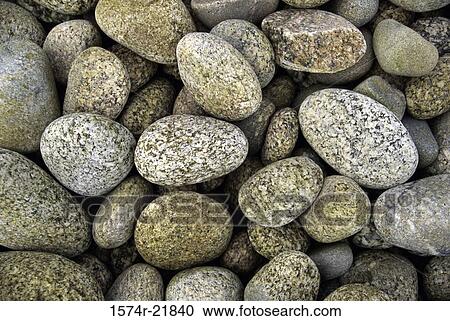 Stock Image - Close-up of rounded stones, Bryher, Isles of Scilly, Cornwall, England. Fotosearch
