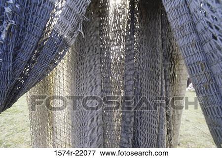 Stock Photo - Close-up of suspended fishing nets. Fotosearch