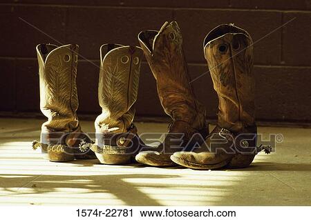 Close-up of two pairs of cowboy boots View Large Photo Image Stock Image - Close-up of two pairs of cowboy boots. Fotosearch