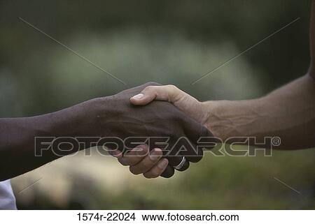 Picture - Close-up of two people shaking hands. Fotosearch