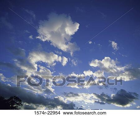 Clouds in a blue sky View Large Photo Image Picture - Clouds in a blue sky. Fotosearch