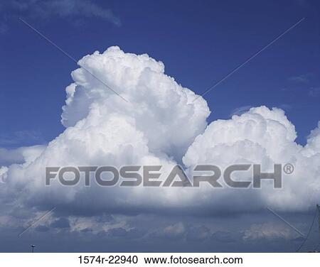 Clouds in a blue sky View Large Photo Image Stock Image - Clouds in a blue sky. Fotosearch