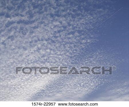 Clouds in a blue sky View Large Photo Image Stock Photo - Clouds in a blue sky. Fotosearch