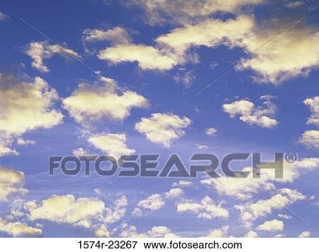 Clouds in a blue sky View Large Photo Image Stock Photo - Clouds in a blue sky. Fotosearch