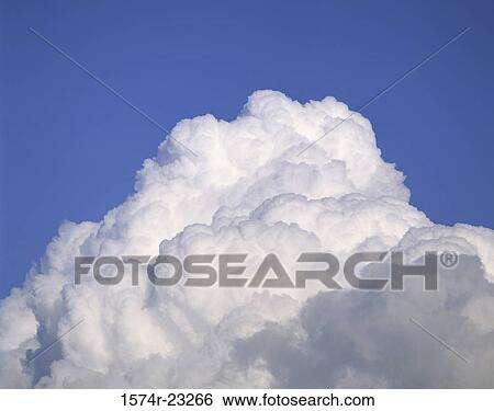 Clouds in a blue sky View Large Photo Image Stock Photograph - Clouds in a blue sky. Fotosearch