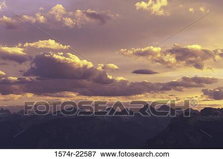 Stock Photo - Clouds in the sky at sunset, British Columbia, Canada. Fotosearch