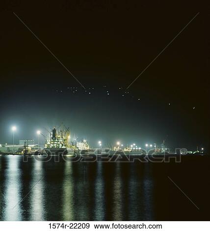 Container ships at night View Large Photo Image Stock Photo - Container ships at night. Fotosearch