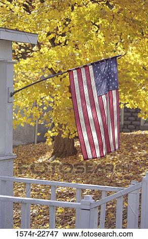 Stock Photo - Flag of the United States of America on a front porch. Fotosearch