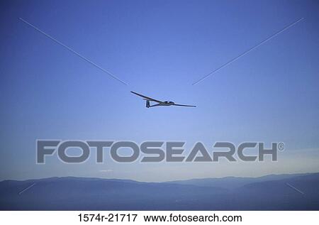 Glider flying in the sky View Large Photo Image Stock Photo - Glider flying in the sky. Fotosearch