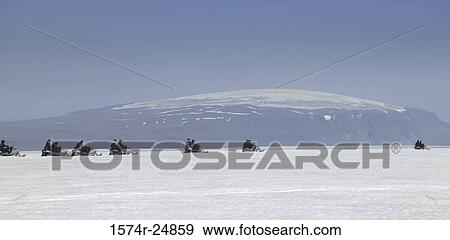 Group of snowmobilers on a snow covered landscape, Langjokull Glacier, Eiriksjokull Glacier, Iceland View Large Photo Image Stock Photo - Group of snowmobilers on a snow covered landscape, Langjokull Glacier, Eiriksjokull Glacier, Iceland. Fotosearch