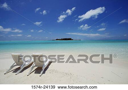 Stock Photo - High angle view of two beach chairs on the beach. Fotosearch