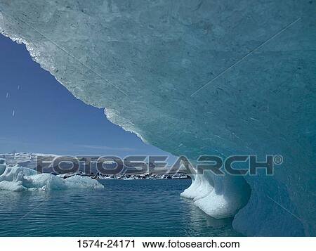 Iceberg floating on water, Jokulsarlon, Iceland View Large Photo Image Stock Image - Iceberg floating on water, Jokulsarlon, Iceland. Fotosearch