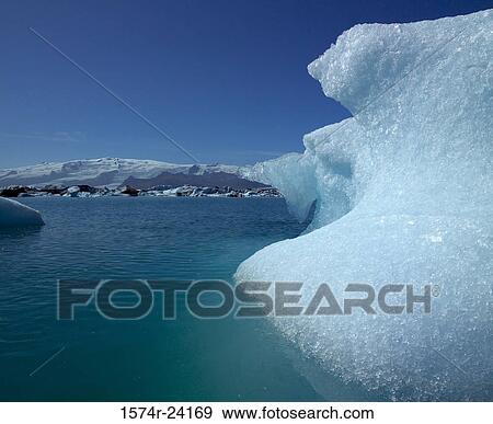 Iceberg floating on water, Jokulsarlon, Iceland View Large Photo Image Stock Photo - Iceberg floating on water, Jokulsarlon, Iceland. Fotosearch