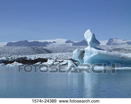 Iceberg floating on water, Jokulsarlon, Iceland View Large Photo Image Stock Photo - Iceberg floating on water, Jokulsarlon, Iceland. Fotosearch
