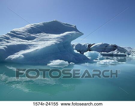 Iceberg floating on water, Jokulsarlon, Iceland View Large Photo Image Stock Photography - Iceberg floating on water, Jokulsarlon, Iceland. Fotosearch