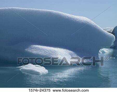 Stock Photography - Iceberg floating on water, Jokulsarlon, Iceland. Fotosearch