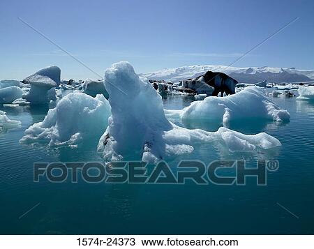 Stock Image - Icebergs floating on water, Jokulsarlon, Iceland. Fotosearch