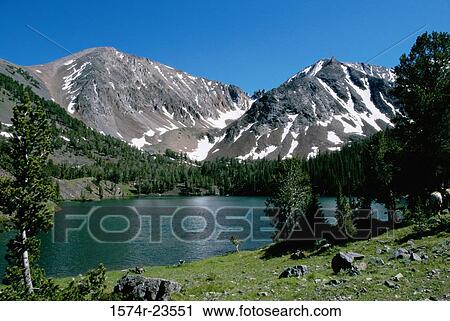 Lake surrounded by mountains, Crater Lake, White Clouds Mountains, Stanley, Idaho, USA View Large Photo Image Stock Image - Lake surrounded by mountains, Crater Lake, White Clouds Mountains, Stanley, Idaho, USA. Fotosearch