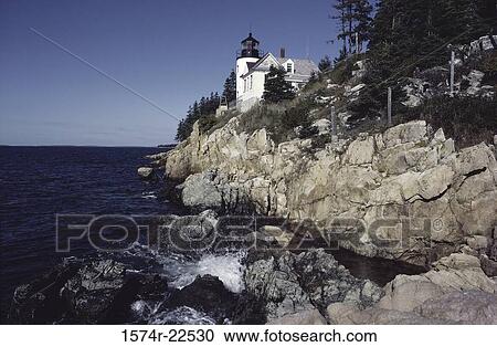 Stock Image - Lighthouse at a rocky coast, Bass Harbor Head Lighthouse, Mount Desert Island, Maine, USA. Fotosearch