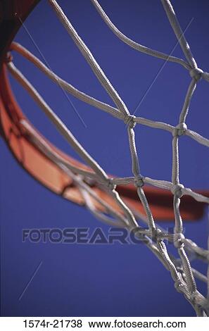 Low angle view of a basketball hoop View Large Photo Image Stock Photo - Low angle view of a basketball hoop. Fotosearch