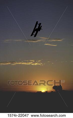 Low angle view of a crop duster plane over a field View Large Photo Image Stock Photo - Low angle view of a crop duster plane over a field. Fotosearch