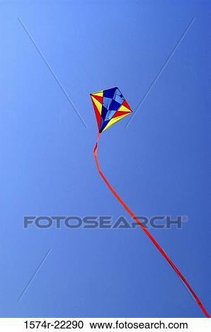 Low angle view of a kite in the sky View Large Photo Image Stock Image - Low angle view of a kite in the sky. Fotosearch