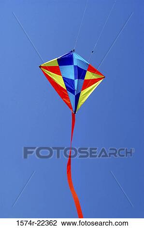 Low angle view of a kite in the sky View Large Photo Image Stock Image - Low angle view of a kite in the sky. Fotosearch