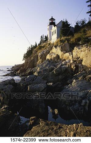 Low angle view of a lighthouse on a cliff, Bass Head Lighthouse, Mount Desert Island, Maine, USA View Large Photo Image Stock Photo - Low angle view of a lighthouse on a cliff, Bass Head Lighthouse, Mount Desert Island, Maine, USA. Fotosearch