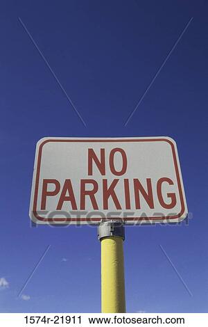 Low angle view of a no parking sign View Large Photo Image Stock Image - Low angle view of a no parking sign. Fotosearch
