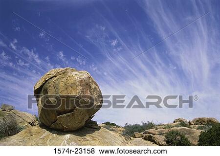 Stock Photo - Low angle view of a rock on a landscape, South Africa. Fotosearch