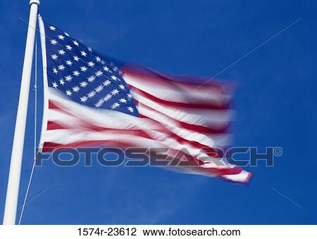 Low angle view of an American flag View Large Photo Image Stock Image - Low angle view of an American flag. Fotosearch