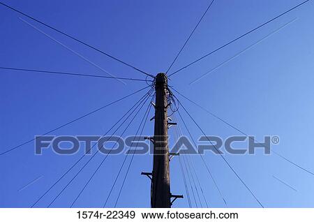 Stock Photo - Low angle view of an electric post. Fotosearch