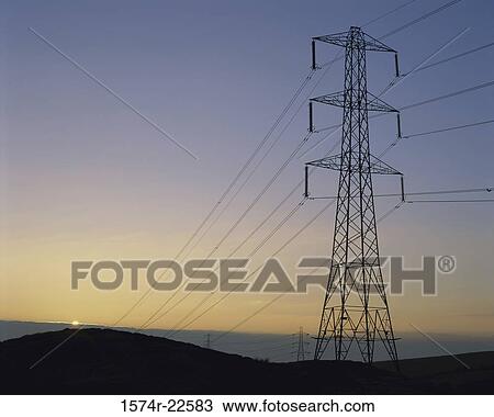 Stock Image - Low angle view of an electricity pylon. Fotosearch
