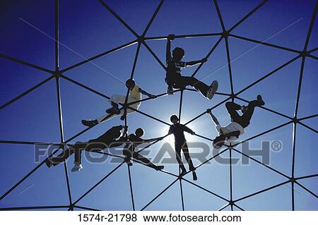 Low angle view of children on a jungle gym View Large Photo Image Stock Photo - Low angle view of children on a jungle gym. Fotosearch